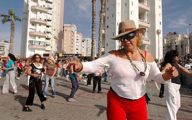 A mixed community in Bat Yam, where Russian immigrants swim in the dead of winter, locals Israeli dance on the boardwalk, and a new stream of urban, artsy Israelis seek lower rents for their studios and living spaces. (photo credit: Yossi Zamir/Flash90)