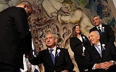 Prime Minister Benjamin Netanyahu, center, shakes hands with Jewish Home leader Naftali Bennett at the opening session of the Knesset in February 2013, as President Shimon Peres looks on. Behind them are Labor's Shelly Yachimovich and Yesh Atid's Yair Lapid. (Photo credit: Nati Shohat/Flash90)