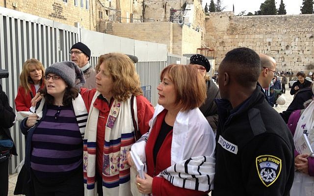Sachs, Hoffman and Nevo (from right to left), being led to the police station (Photo credit: Mitch Ginsburg/ Times of Israel)