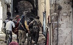 Members of the Jabhat al-Nusra organization, which is an affiliate of al-Qaeda and one of the stronger opposition groups in Syria. (Photo credit: wikicommons)