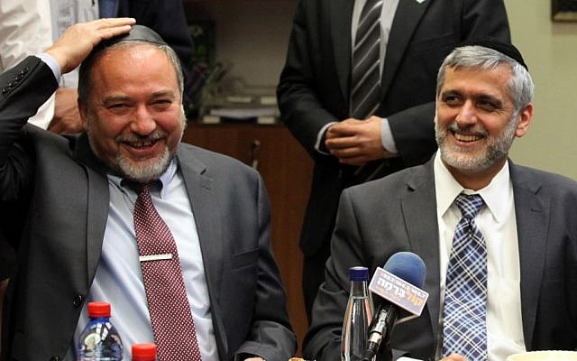 Former foreign minister MK Avigdor Liberman and Shas leader MK Eli Yishai at a celebration for MK Aryeh Deri's birthday, held at the Knesset, February 18, 2013 (photo credit: Flash90)