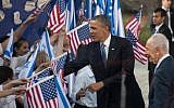 US President Barack Obama (left) and President Shimon Peres are greeted by children waving Israeli and American flags at a welcoming ceremony held for Obama in Jerusalem in March. (photo credit: Uri Lenz/Flash90)