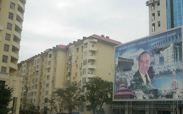 A billboard in Baku, capital of Azerbaijan, showing former Azerbaijani president Heydar Aliyev, "the founder of modern Azerbaijan." Aliyev was succeeded by his son Ilham in 2003; opposition figures accuse his government of suppressing pro-democracy voices within the former Soviet republic. (photo credit: Yifa Yaakov/The  Times of Israel)