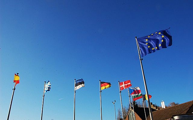 Flags outside the European Union in Brussels (photo credit: Flickr/BY 2.0/motiqua )
