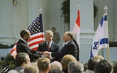 The triple handshake: prime minister Menachem Begin, president Jimmy Carter, and president Anwar Sadat after signing the Israel-Egypt peace treaty in March 1979. (GPO/Tal Shabtai)