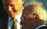 Then-US president Bill Clinton laughs with prime minister Yitzhak Rabin upon his arrival at Ben Gurion Airport, October 27, 1994. Clinton arrived in Israel after a trip to Syria where he met with president Hafez Assad in an attempt to further the Middle East peace process. Later, speaking to the Knesset, Clinton said of Syria, 'Its leaders understand it is time to make peace.' (AP/David Brauchli)