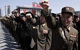 North Korean army officers punch the air as they chant slogans during a rally at Kim Il Sung Square in downtown Pyongyang, North Korea, Friday, March 29 (AP/Jon Chol Jin)