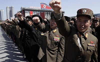 North Korean army officers punch the air as they chant slogans during a rally at Kim Il Sung Square in downtown Pyongyang, North Korea, Friday, March 29 (AP/Jon Chol Jin)