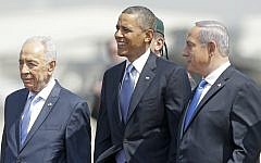 US President Barack Obama, center, is greeted by President Shimon Peres, left, and Prime Minister Benjamin Netanyahu upon his arrival at Ben Gurion Airport in March (photo credit: AP/Pablo Martinez Monsivais)