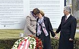 Austrian Interior Minister Johanna Mikl-Leitner, left, Resistance fighter Katharina Sasso and Chancellor Werner Faymann attend a March 12, 2013 unveiling of a plaque honoring Austrians killed by the Nazis. (Hans Punz/AP)