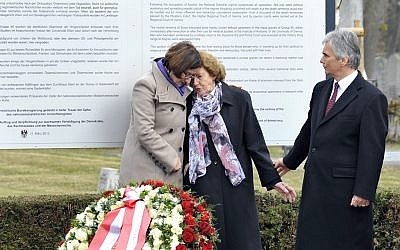 Austrian Interior Minister Johanna Mikl-Leitner, left, Resistance fighter Katharina Sasso and Chancellor Werner Faymann attend a March 12, 2013 unveiling of a plaque honoring Austrians killed by the Nazis. (Hans Punz/AP)