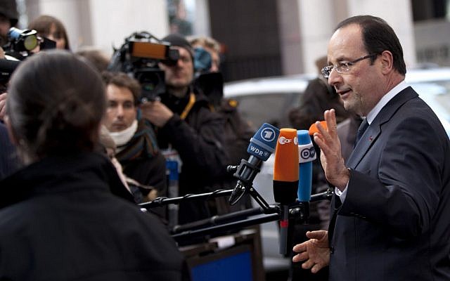 French President Francois Hollande speaks with the media as he arrives for an EU summit in Brussels on Thursday, March 14, 2013. (photo credit: AP/Virginia Mayo) French President Francois Hollande speaks with the media as he arrives for an EU summit in Brussels on Thursday, March 14, 2013. (photo credit: AP/Virginia Mayo)