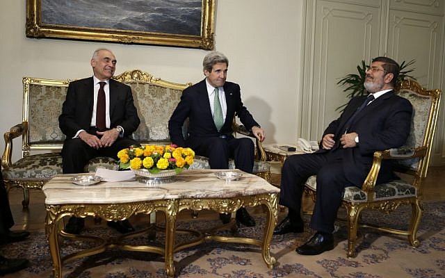 Egyptian Foreign Minister Mohammed Kamel Amr, US Secretary of State John Kerry, and Egyptian president Mohammed Morsi take their seats at the start of their meeting at the Presidential Palace in Cairo, Egypt, on Sunday, March 3, 2013. (photo credit: AP/Jacquelyn Martin, Pool) Egyptian Foreign Minister Mohammed Kamel Amr, US Secretary of State John Kerry, and Egyptian president Mohammed Morsi take their seats at the start of their meeting at the Presidential Palace in Cairo, Egypt, on Sunday, March 3, 2013. (photo credit: AP/Jacquelyn Martin, Pool)
