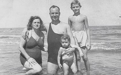 Eli Haim, right, went on vacation with his parents and younger brother in Port Said in 1945. (Courtesy of Ada Aharoni via JTA)