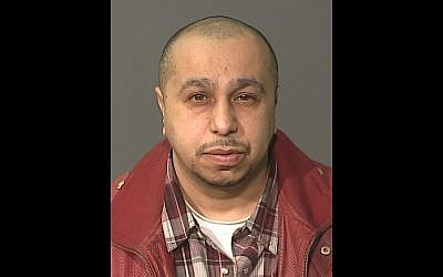 This undated photo, provided by the New York City Police Department on Monday March 4, 2013, shows Julio Acevedo, 44, who police are looking for in connection with the death of an expectant couple that was killed in a car accident in Brooklyn early Sunday morning and their premature baby, who was delivered alive but did not survive.(photo credit: AP/NYPD)