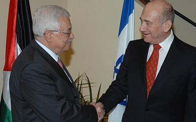 Then-prime minister Eud Olmert shakes hands with Palestinian Authority President Mahmoud Abbas in Jerusalem, 2008 (photo credit: Moshe Milner/GPO/Flash90)