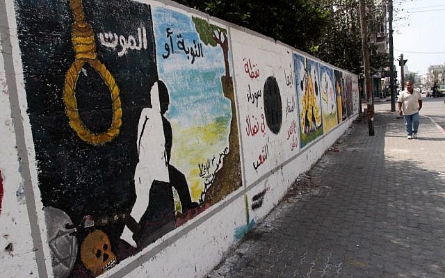 A mural in Gaza in the previous anti-collaboration campaign reads 'Repentance or death,' September 2010. (photo credit: Abed Rahim Khatib/Flash90) A mural in Gaza in the previous anti-collaboration campaign reads 'Repentance or death,' September 2010. (photo credit: Abed Rahim Khatib/Flash90)
