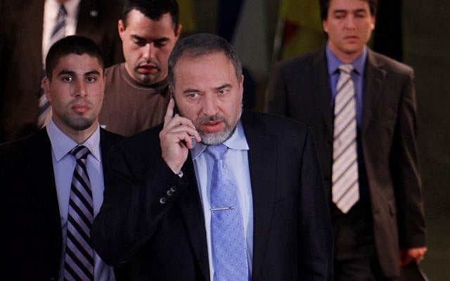 Former foreign minister Avigodor Liberman followed by his bodyguard at the Prime Minister's office in Jerusalem on January 31, 2011. (photo credit: Miriam Alster/Flash90).