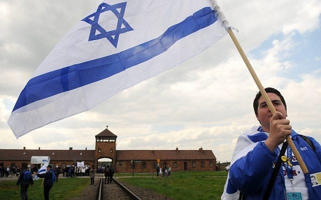 An Israeli young woman waves the Israeli flag as she participates with hundreds of other Israeli youth in "the March of the Living" tour which involves visiting concentration and death camps in Poland. May 02, 2011. (photo credit: Yossi Zeliger/Flash90) An Israeli young woman waves the Israeli flag as she participates with hundreds of other Israeli youth in "the March of the Living" tour which involves visiting concentration and death camps in Poland. May 02, 2011. (photo credit: Yossi Zeliger/Flash90)