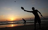 Israelis play paddle-ball at the beach  in Tel Aviv. July 05, 2011. (photo credit: Miriam Alster/Flash90)