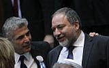 Yair Lapid seen with his hand on the shoulder of Avigdor Liberman during the opening session of Israel's 19th Knesset, February 5, 2013. (Miriam Alster/Flash90)