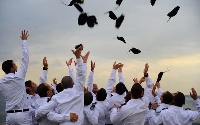 Graduating naval officers of the Israeli Navy toss their hats during a graduation ceremony (Photo credit: Ofir Shifrin/ IDF Spokesperson/Flash 90) Graduating naval officers of the Israeli Navy toss their hats during a graduation ceremony (Photo credit: Ofir Shifrin/ IDF Spokesperson/Flash 90)