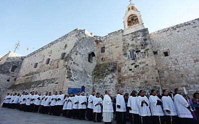 Clergymen in Manger Square outside the Church of the Nativity in Bethlehem on December 24, 2012 (photo credit: Issam Rimawi/Flash90)