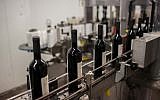 Illustrative photo of kosher wine production in Israel. (Yonatan Sindel/Flash90)
