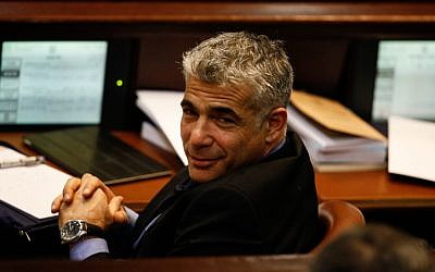 Yesh Atid leader Yair Lapid at the assembly hall of the Knesset in Jerusalem on February 12 (photo credit: Flash90)