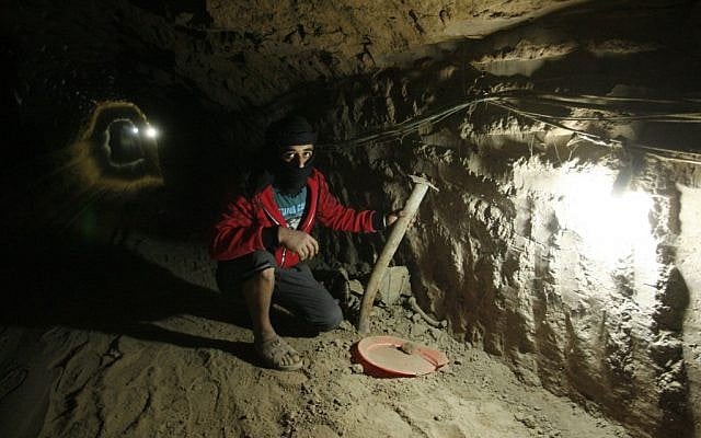 A Palestinian works inside a smuggling tunnel, beneath the Egyptian-Gaza border in Rafah, in the southern Gaza Strip, February 19, 2013. (photo credit: Abed Rahim Khatib/Flash90) A Palestinian works inside a smuggling tunnel, beneath the Egyptian-Gaza border in Rafah, in the southern Gaza Strip, February 19, 2013. (photo credit: Abed Rahim Khatib/Flash90)