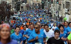 Runners take part in the third international Jerusalem marathon on Friday (photo credit: Yonatan Sindel/Flash90)