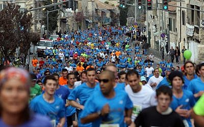 Runners take part in the third international Jerusalem marathon on Friday (photo credit: Yonatan Sindel/Flash90)