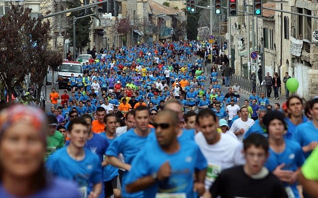 Runners take part in the third international Jerusalem marathon on Friday (photo credit: Yonatan Sindel/Flash90) Runners take part in the third international Jerusalem marathon on Friday (photo credit: Yonatan Sindel/Flash90)