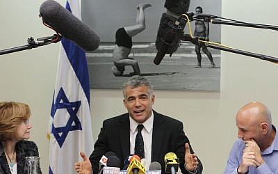 Finance Minister Yair Lapid at a party meeting in early March. (Photo credit: Miriam Alster/FLASH90)