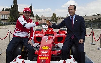 Formula One Scuderia Ferrari team driver Giancarlo Fisichella and Jerusalem mayor Nir Barkat toast ahead of the 'Formula Jerusalem - A Peace Journey' showcase (Photo credit: Flash90)