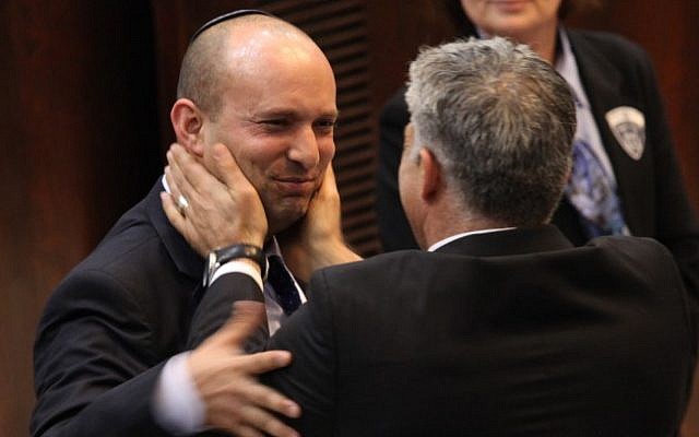 File: Yair Lapid (R) seen with Naftali Bennett at the Knesset in March 2013. (Isaac Harari/Flash90)