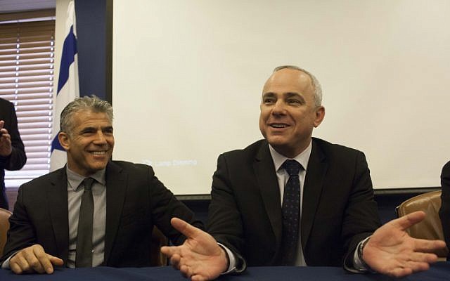 Outgoing Finance minister Yuval Steinitz (Likud) on the right welcomes incoming minister Yair Lapid (Yesh Atid), March 19 2013. (photo credit:Yonatan Sindel/Flash90) Outgoing Finance minister Yuval Steinitz (Likud) on the right welcomes incoming minister Yair Lapid (Yesh Atid), March 19 2013. (photo credit:Yonatan Sindel/Flash90)