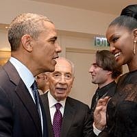 US President Barack Obama, left, shake hands with Yityish 'Titi' Aynaw, a 21-year old Ethiopian-Israeli woman who was the first Ethiopian-born woman to be crowned Miss Israel, at the presidential residence in Jerusalem, in March 2013, as President Shimon Peres (center) looks on. (photo credit: Avi Ohayon/Flash90)