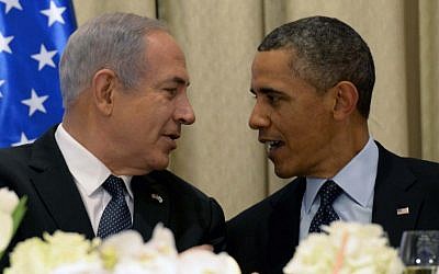 President Barack Obama, right, talks with Prime Minister Benjamin Netanyahu at a state dinner in Obama's honor in March 2013, at the President's Residence in Jerusalem. (photo credit: Avi Ohayon/Flash90)