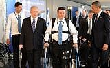 Illustrative: Prime Minister Benjamin Netanyahu (left) and former US president Barack Obama look on as disabled IDF veteran Radi Kaiuf demonstrates the ReWalk exoskeleton system. Kaiuf, who was formerly nearly fully paralyzed, completed the Israel Marathon in 2012 using the system (Kobi Gideon / GPO /FLASH90)