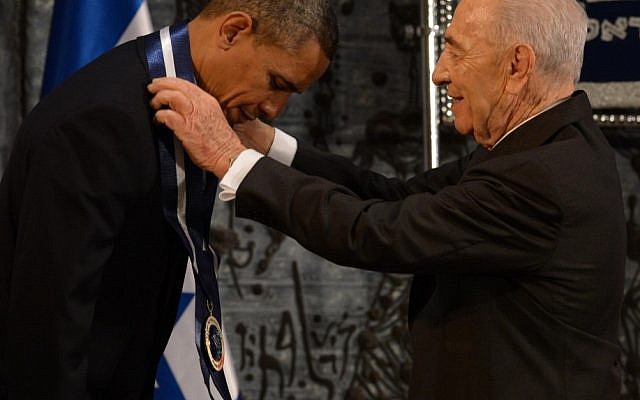 President Shimon Peres presents US President Barack Obama with the Presidential Medal of Distinction at the presidential residence in Jerusalem, Thursday. (photo credit: Mark Neyman/Flash90)