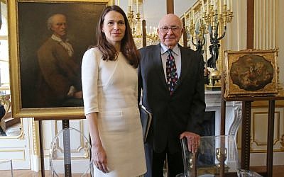 French Culture Minister Aurelie Filippetti returned six stolen paintings to American heir Thomas Selldorff at Tuesday's ceremony. (Michel Euler/AP)