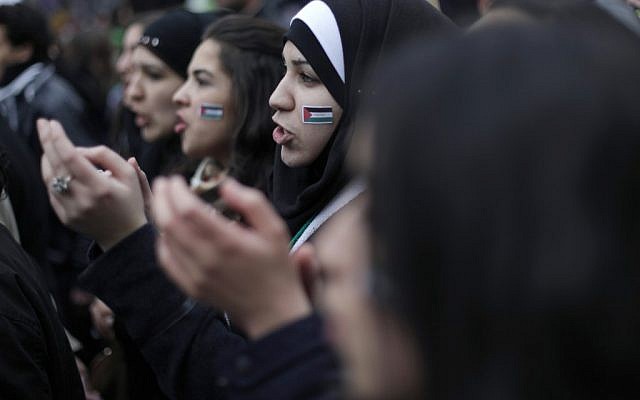 Demonstrators chant slogans during a march to mark the second anniversary of the revolt against the Syrian government of President Bashar Assad, in Paris, Saturday, March 16, 2013 (photo credit: Thibault Camus/AP) Demonstrators chant slogans during a march to mark the second anniversary of the revolt against the Syrian government of President Bashar Assad, in Paris, Saturday, March 16, 2013 (photo credit: Thibault Camus/AP)