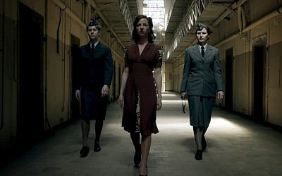 Undated photo depicts Greta (Katharina Schuettler) walking through a prison in a scene of the wartime drama 'Our Mothers, Our Fathers' ('Unsere Muetter, unsere Vaeter'). (photo credit: AP/ZDF/David Slama)
