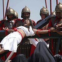 Filipino penitent Ruben Enaje, who has portrayed as Jesus Christ for 27 times, grimaces as he is nailed to the cross during Good Friday rituals on March 29, 2013 at Cutud, Pampanga province, northern Philippines (AP Photo/Aaron Favila) Filipino penitent Ruben Enaje, who has portrayed as Jesus Christ for 27 times, grimaces as he is nailed to the cross during Good Friday rituals on March 29, 2013 at Cutud, Pampanga province, northern Philippines (AP Photo/Aaron Favila)
