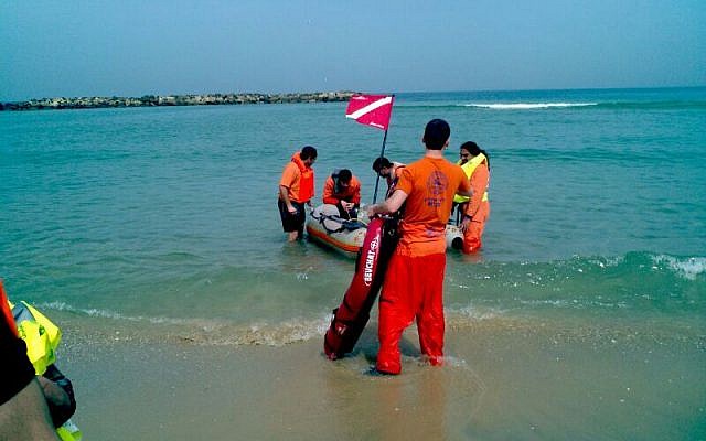 ZAKA personnel search for the body of 26-year-old Nahed Sariye in Ashkelon, Sunday. (photo credit: Boaz Ben-Ari/ZAKA) ZAKA personnel search for the body of 26-year-old Nahed Sariye in Ashkelon, Sunday. (photo credit: Boaz Ben-Ari/ZAKA)