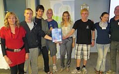 Members of the winning team show off their Certificate of Achievement (photo credit: Courtesy Amal Group)