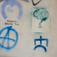 A selection of stencil, the one on the upper left says, 'A love revolution' (photo credit: Jessica Steinberg/Times of Israel)
