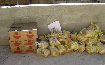 Parcels of bread collected from settlements await distribution in the Palestinian village of Sawiyah Monday (photo credit: courtesy/Yaki Fried)