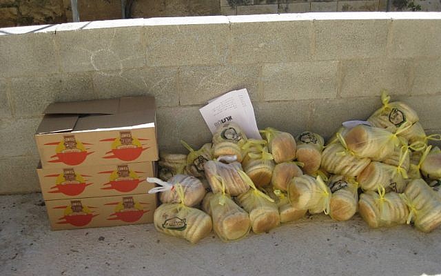Parcels of bread collected from settlements await distribution in the Palestinian village of Sawiyah Monday (photo credit: courtesy/Yaki Fried) Parcels of bread collected from settlements await distribution in the Palestinian village of Sawiyah Monday (photo credit: courtesy/Yaki Fried)
